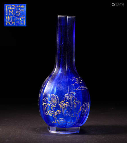 A BLUE LONG-NECKED GLASS VASE