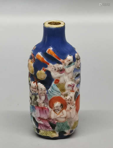 A CERVED PORCELAIN SNUFF BOTTLE