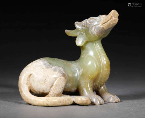 A HETIAN CELADON JADE SITTING  DRAGON FIGURINE