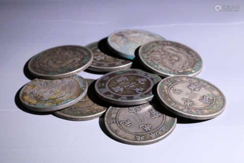A SET OF VINTAGE SILVER COINS