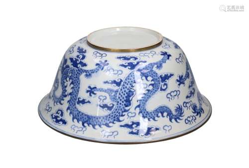A blue and white porcelain bowl with brass mounts and a deco...
