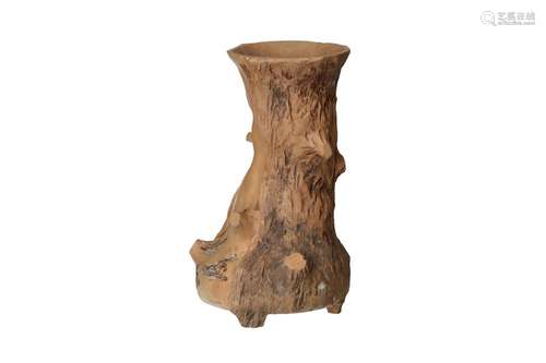 A Yixing brush pot in the shape of a tree trunk. Marked with...