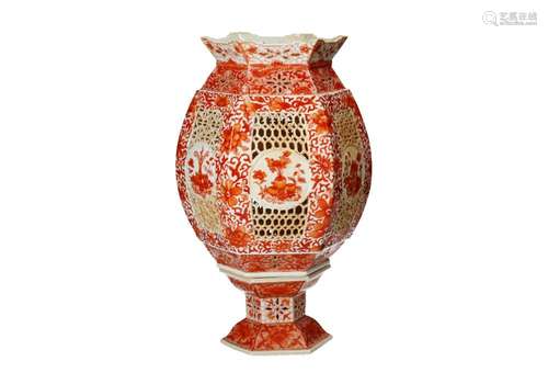 An iron red porcelain lantern with a floral decor, on loose ...