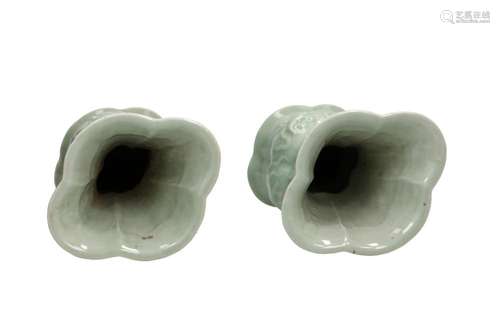 A pair of celadon glazed porcelain scalloped vases after bro...