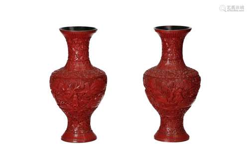 A pair of cinnabar lacquer vases on a bamboo body, with carv...