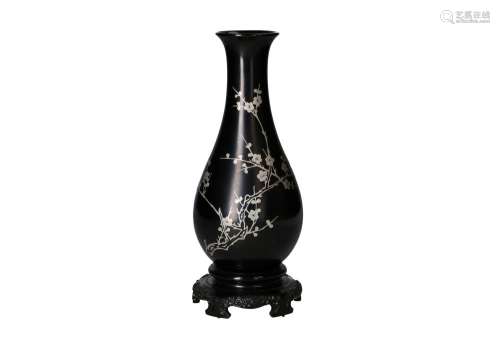 A pair of black lacquer vases with an inlaid silver decorati...