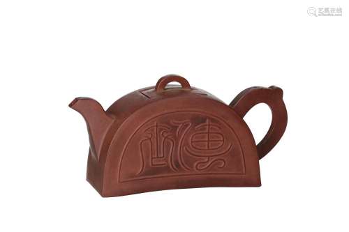 A Yixing roof tile-shaped teapot, decorated with archaic scr...