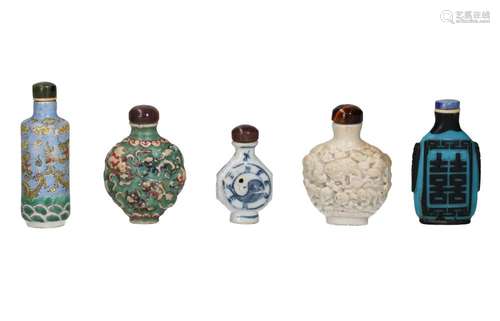 Lot of five snuff bottles 1) porcelain relief decoration wit...