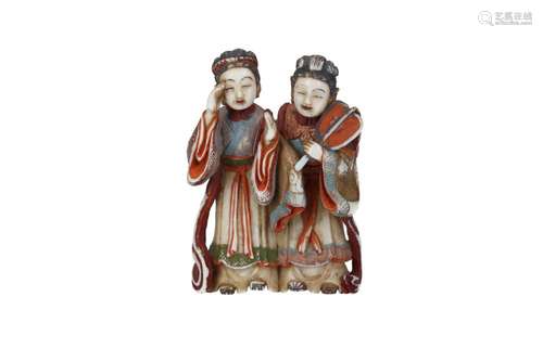 A polychrome ivorynetsuke depicting two ladies in waiting, o...