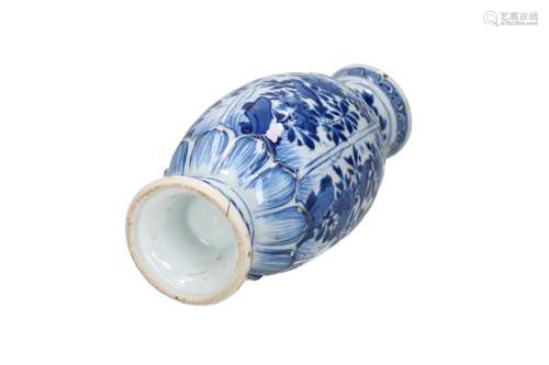 A blue and white porcelain vase, decorated with flowers and ...