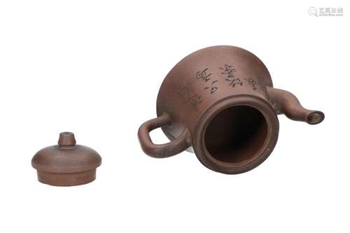 Lot of two Yixing teapots, 1) round. Marked with 7-character...