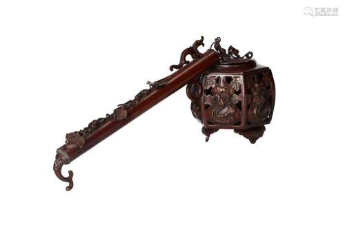 A portable bronze censer with long grip and cover with relie...