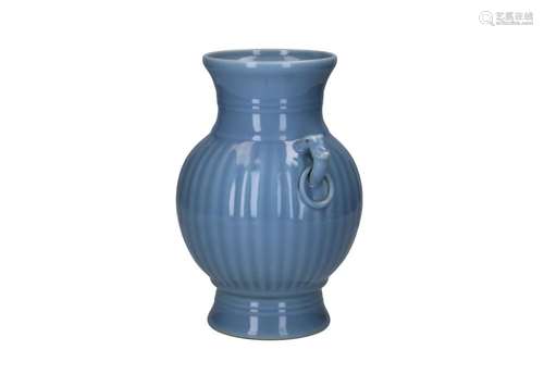 A clair de lune glazed porcelain ribbed vase with handles in...