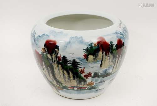 A polychrome porcelain cachepot, decorated with a landscape....