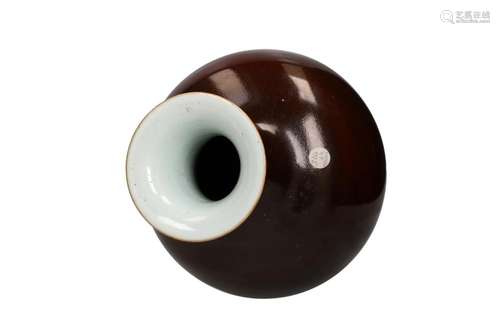 A chocolate brown glazed porcelain baluster vase. Unmarked. ...