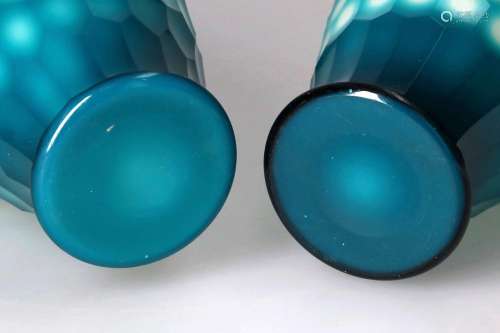 A pair of blue on white glass baluster vases with a hexagona...