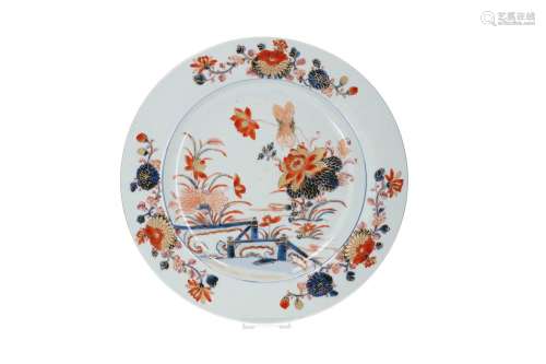 A pair of Imari porcelain chargers, decorated with a garden ...