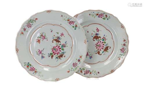 A set of seven famille rose porcelain dishes with a scallope...
