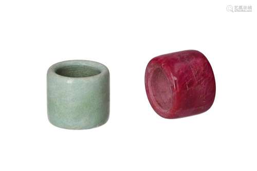 A collection of eight thumb rings of various materials, incl...