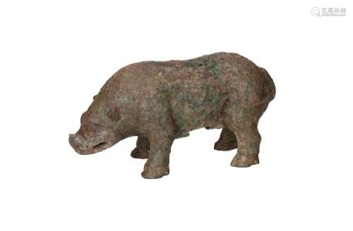 A bronze sculpture of a pig. China, Eastern Zhou or later. H...