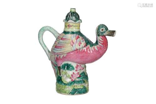 A polychrome porcelain teapot in the shape of a bird with a ...