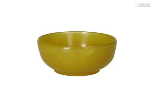 A bowl of yellow serpentine stone. Marked with sticker Earle...