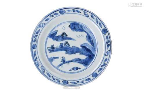 A blue and white porcelain dish, decorated with two reading ...