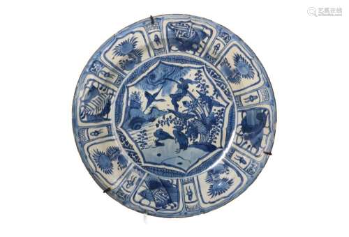 A blue and white porcelain deep charger, decorated with rese...