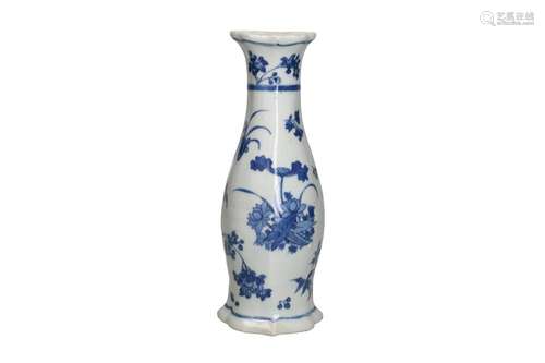 A blue and white porcelain wall vase with a floral decor. Un...