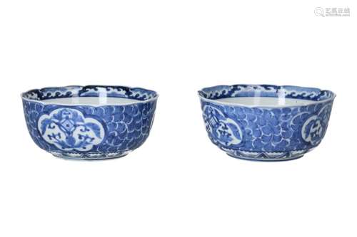 A pair of blue and white porcelain bowls, decorated with flo...