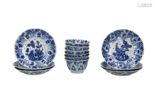 A set of six blue and white porcelain cups and saucers with ...