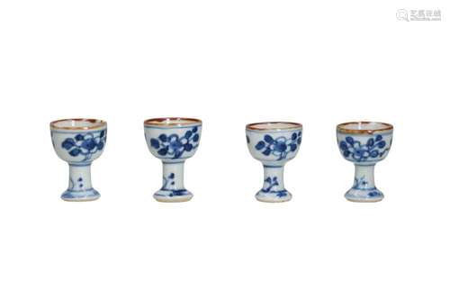 Four blue and white porcelain stemcups with a floral decorat...