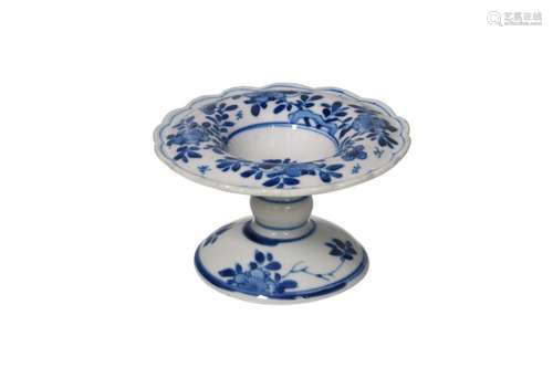 A blue and white porcelain salt cellar, with a floral decora...