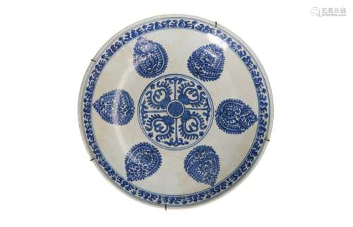 A blue and white porcelain charger, decorated with a geometr...