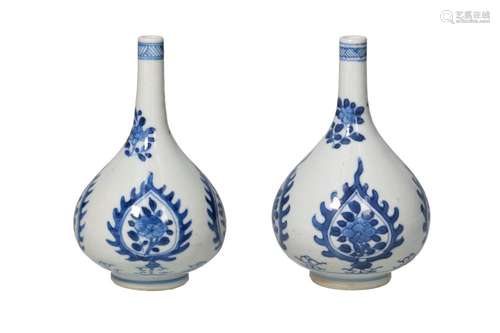 A pair of belly-shaped blue and white porcelain vases, decor...