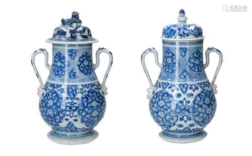 A pair of blue and white porcelain vases with two handles. U...