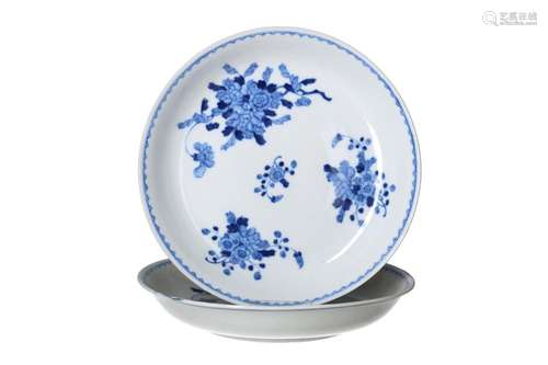 A pair of blue and white porcelain deep dishes, decorated wi...