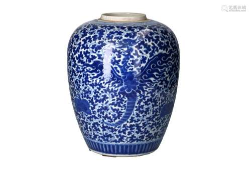 A blue and white porcelain ginger jar on wooden base, decora...