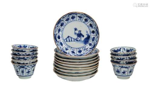 A set of nine blue and white porcelain cups and saucers deco...