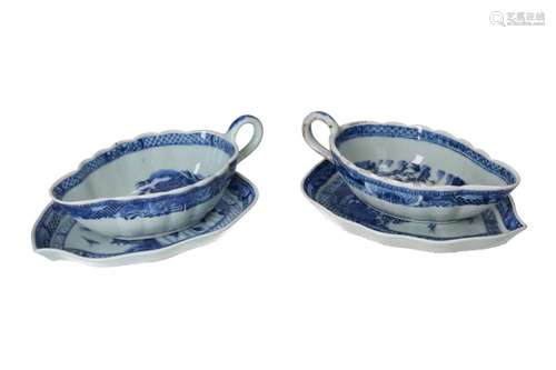 A pair of blue and white porcelain sauce boats with dish and...