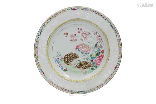 A famille rose porcelain plate decorated with flowers and tw...