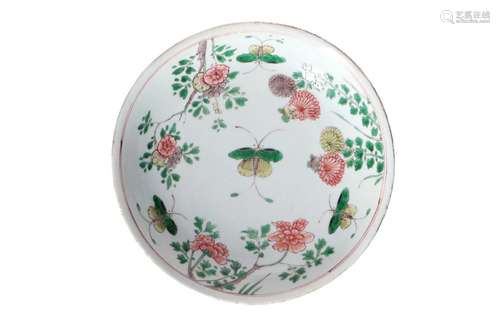 A famille verte porcelain deep dish, decorated with flowers ...