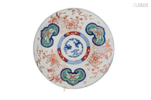 An Imari porcelain charger, decorated with flowers and terra...