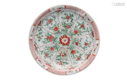 A polychrome porcelain deep charger, decorated with flowers....