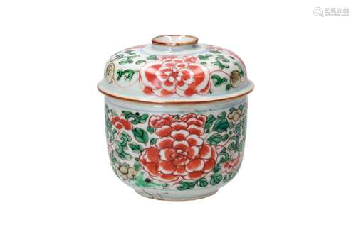 A polychrome porcelain lidded jar, decorated with leaves and...