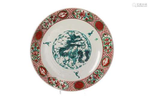 A polychrome Swatow porcelain charger, decorated with a drag...