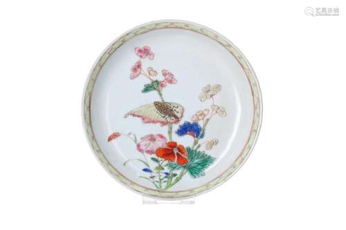 A polychrome porcelain saucer, decorated with flowers and an...