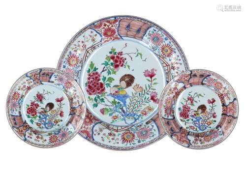 A set of two polychrome porcelain deep dishes and a charger,...