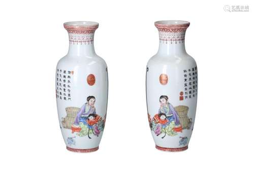 A pair of polychrome porcelain vases, decorated with figures...