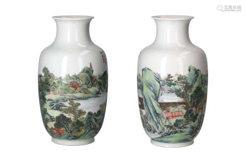 A pair of polychrome porcelain vases, decorated with figures...